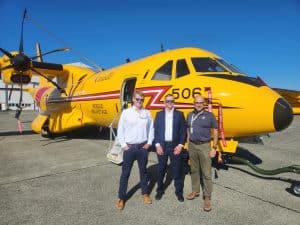 CEO Sam Mayall stood with others infront of SAR Aircraft